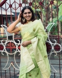 sanusha-santhosh-new-photos-in-green-saree-001