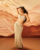 shruti-haasan-in-Pearl-White-Lehenga-Choli-a-strappy-corset-style-bralette-top-with-scalloped-borders-and-matching-high-waisted-embellished-skirt-waistline-and-Mirror-work-001