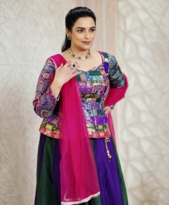 shweta-menon-in-multi-colored-geometric-and-brocade-style-jacket-style-peplum-top-with-dual-tone-color-flared-lehenga-with-heavy-vertical-pleating-002