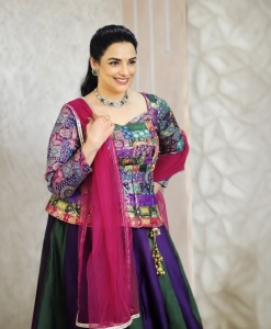 shweta-menon-in-multi-colored-geometric-and-brocade-style-jacket-style-peplum-top-with-dual-tone-color-flared-lehenga-with-heavy-vertical-pleating-003