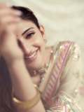 sreeleela-in-Ivory-colour-saree-with-multicolour-border-and-tube-style-matching-embroidered-blouse-pics