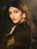 sreeleela-in-luxurious-black-velvet-jacket-featuring-a-sharp-V-neckline-Cinctured-at-the-waist-with-a-statement-geometric-belt-photos-004