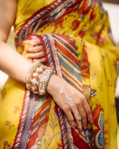 tamanna-in-yellow-saree-with-red-border-vvaan-launch-look-photo-002