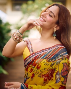 tamanna-in-yellow-saree-with-red-border-vvaan-launch-look-photo-005