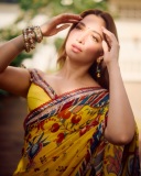 tamanna-in-yellow-saree-with-red-border-vvaan-launch-look-photo-004
