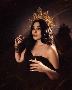 veena-nandakumar-in-black-off-shoulder-gown-with-crown-photos-003