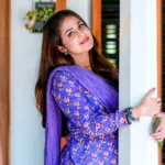malavika wales in violet simple churidar dress photos