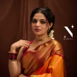 nikhila vimal in orange orange pattu saree with maroon red blouse photos 004