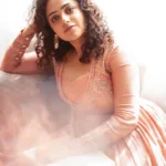 nithya menon in peach colour dress photos