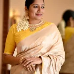 anumol in golden saree with yellow blouse photos 005
