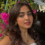 devika sanjay in white off shoulder top with jeans short skirt photos 002