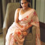 parvathy thiruvothu in floral design saree photos