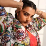 parvathy thiruvothu in multi colour coat with pink inner dress photos 002