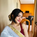 nandana varma in red blouse and set saree combo for vishu 001