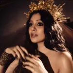 veena nandakumar in black off shoulder gown with crown photos-002