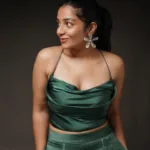 rajisha vijayan glamorous photoshoot in Charlotte Pleated Christmas Green Trouser with Satin Finish Top 003