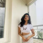 nandana varma white outfit with white cap style photos-002