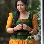 anu sithara in green and yellow dhavani combination photos-001