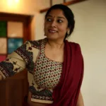 actress anumol in maroon saree with design blouse latest photos 007