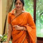 actress anumol in orange saree with black mundhanai style photos