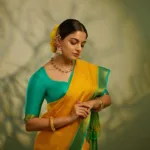nikhila vimal in mango yellow saree with contrast blouse photos