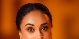 Pearle Maaney pearle maaney in Deep V neckline embroidery blouse with Sheer black organza saree Black velvet band choker centered with a gold circular photos