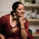 actress anumol in maroon colour saree images 003