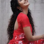 anupama parameswaran in red saree with flower print design and trending fashion photos