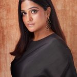 remya nambeesan in black outfit paired with snake themed earrings photos