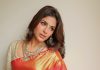 Samyuktha Menon samyuktha menon in rich crimson red silk saree with contrasting off white elbow length blouse and layered necklace encrusted with green gemstones