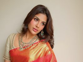 Samyuktha Menon samyuktha menon in rich crimson red silk saree with contrasting off white elbow length blouse and layered necklace encrusted with green gemstones