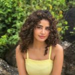 anupama parameswaran in yellow colour frock outfit style photos