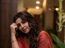 Nikki Galrani nikki galrani in Tussar silk rust red with warm metallic gold saree and high round neckline blouse and Styled with traditional gold jewelry photos