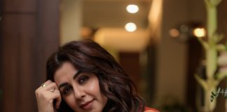 Nikki Galrani nikki galrani in Tussar silk rust red with warm metallic gold saree and high round neckline blouse and Styled with traditional gold jewelry photos
