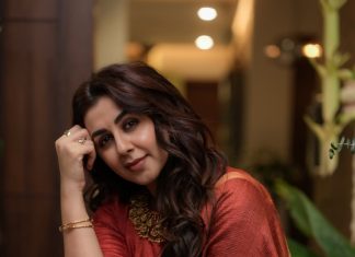 Nikki Galrani nikki galrani in Tussar silk rust red with warm metallic gold saree and high round neckline blouse and Styled with traditional gold jewelry photos