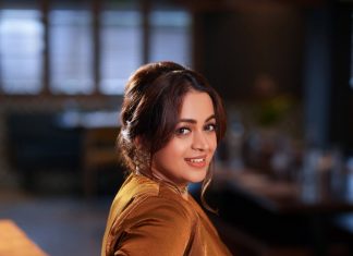 bhavana actress in rich mustard brown symmetrical tulip style draped dhoti skirt dress photos