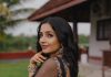 Rajisha Vijayan Actress Rajisha Vijayan A fitted sleeveless V neck crop top and dark Lehenga photos