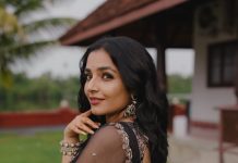 Actress Rajisha Vijayan A fitted sleeveless V neck crop top and dark Lehenga photos