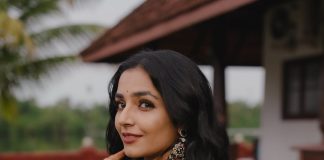 Rajisha Vijayan Actress Rajisha Vijayan A fitted sleeveless V neck crop top and dark Lehenga photos