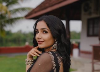 Rajisha Vijayan Actress Rajisha Vijayan A fitted sleeveless V neck crop top and dark Lehenga photos