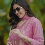 anju kurian in contemporary pastel pink ethnic suit set consisting of a straight cut kurti matching trousers and a dupatta photos