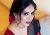 anna rajan in sheer dark navy blue saree with contrasting bright crimson red short sleeved blouse photos