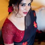 anna rajan in sheer dark navy blue saree with contrasting bright crimson red short sleeved blouse photos