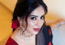 anna rajan in sheer dark navy blue saree with contrasting bright crimson red short sleeved blouse photos