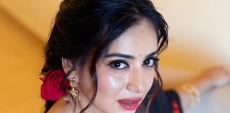 Anna Reshma Rajan anna rajan in sheer dark navy blue saree with contrasting bright crimson red short sleeved blouse photos