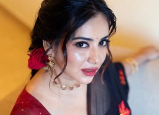anna rajan in sheer dark navy blue saree with contrasting bright crimson red short sleeved blouse photos