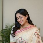kavya madhavan in Off white raditional Kerala inspired modern Saree hand embroidered Matching cream colored elbow length blouse