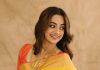 Namitha Pramod namitha pramod in bright sunny yellow silk saree with contrasting solid coral orange silk blouse with plain short sleeves and a scoop neck