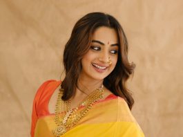 Namitha Pramod namitha pramod in bright sunny yellow silk saree with contrasting solid coral orange silk blouse with plain short sleeves and a scoop neck