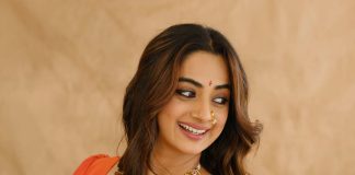 Namitha Pramod namitha pramod in bright sunny yellow silk saree with contrasting solid coral orange silk blouse with plain short sleeves and a scoop neck
